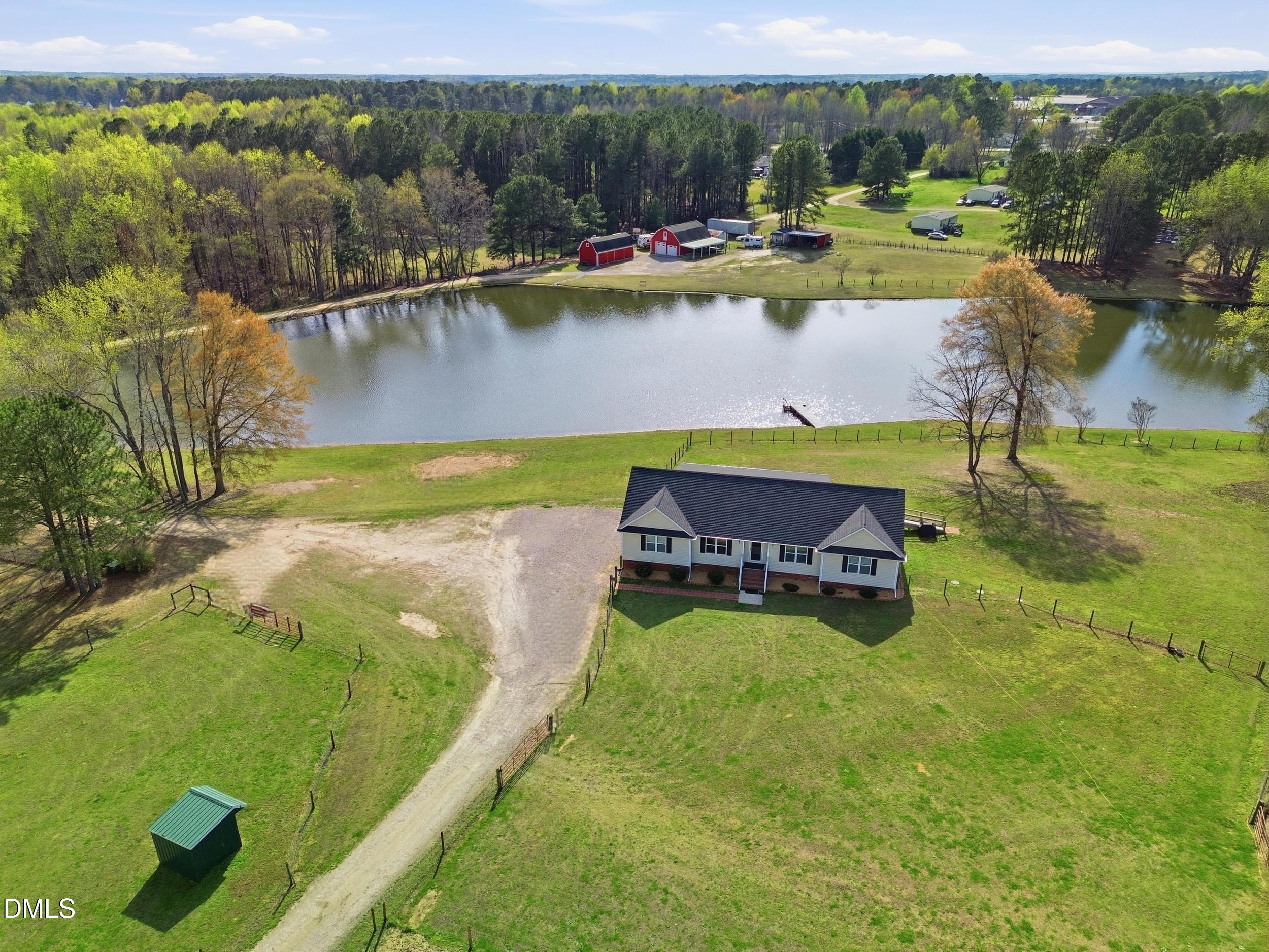 130 Hardy Road Wendell, NC 27591 - Photo 3 of 34 a view of a swimming pool with a lake view