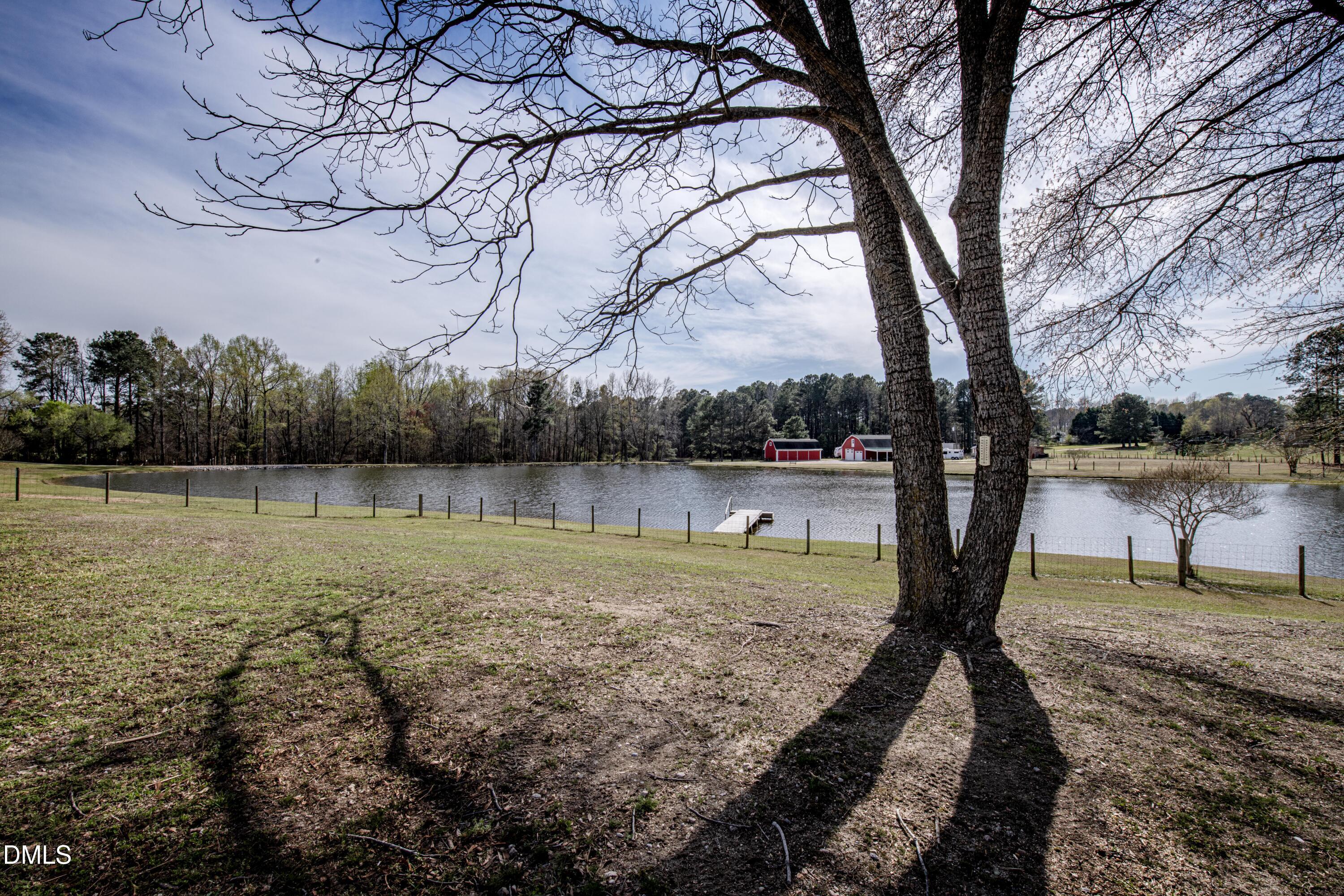 130 Hardy Road Wendell, NC 27591 - Photo 31 of 34 a view of a lake with a yard