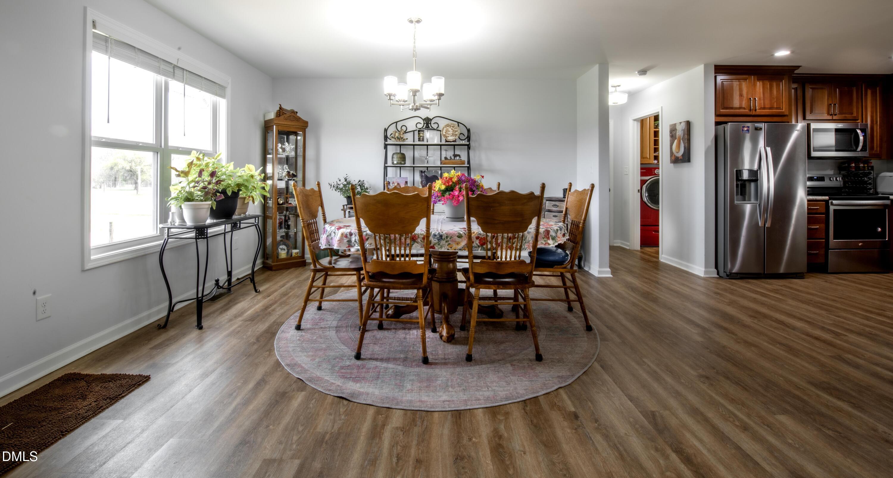 130 Hardy Road Wendell, NC 27591 - Photo 9 of 34 a view of a dining room with furniture window and wooden floor