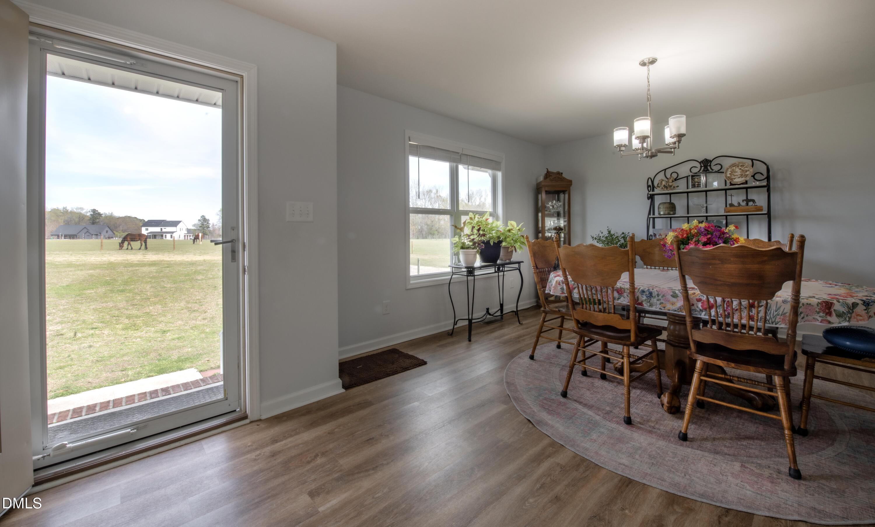 130 Hardy Road Wendell, NC 27591 - Photo 10 of 34 a view of a dining room with furniture window and wooden floor