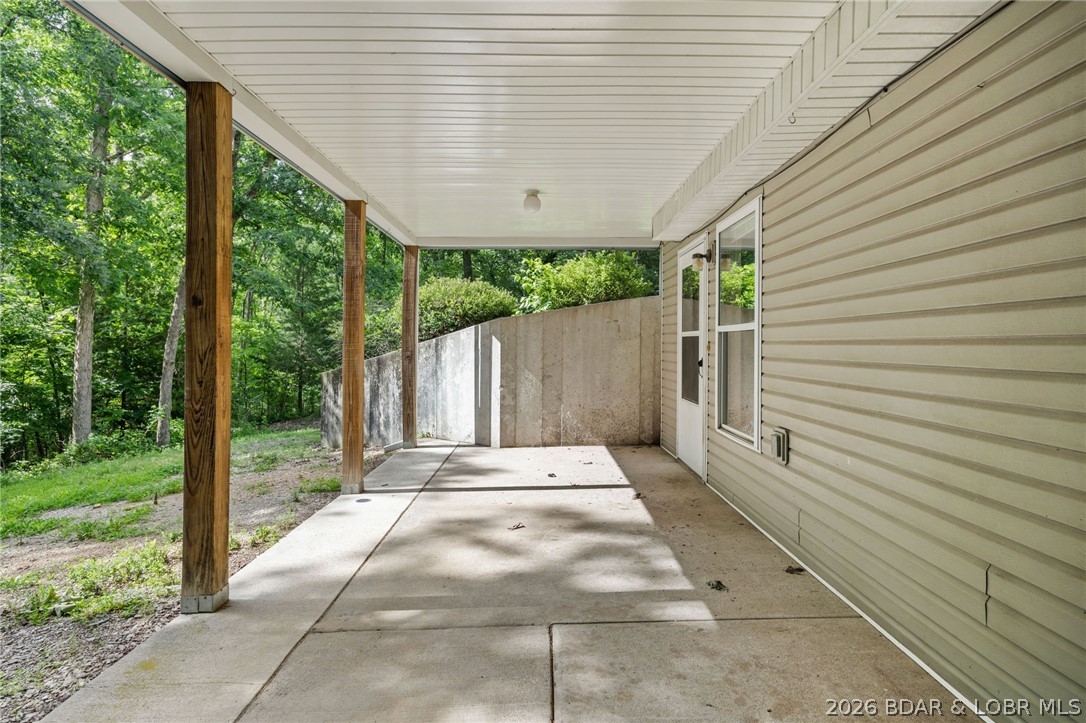 122 Hicks Drive Eldon, MO 65026 - Photo 38 of 51 Covered porch off walk out basement