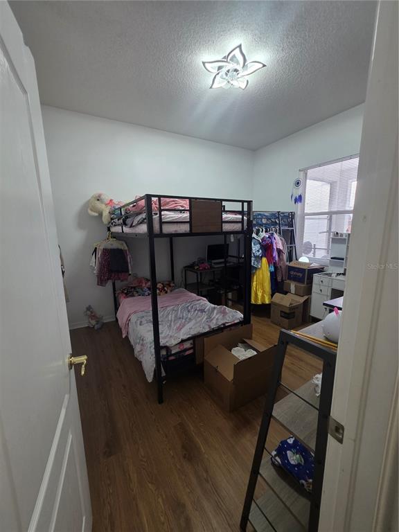 17820 Monteverde Drive Spring Hill, FL 34610 - Photo 24 of 42 a bedroom with a bed and a mirror