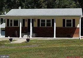 Charming brick-front home with porch.