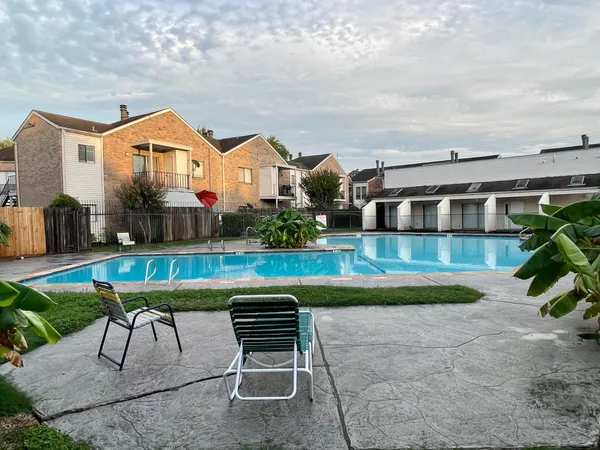 a front view of house with yard and outdoor seating