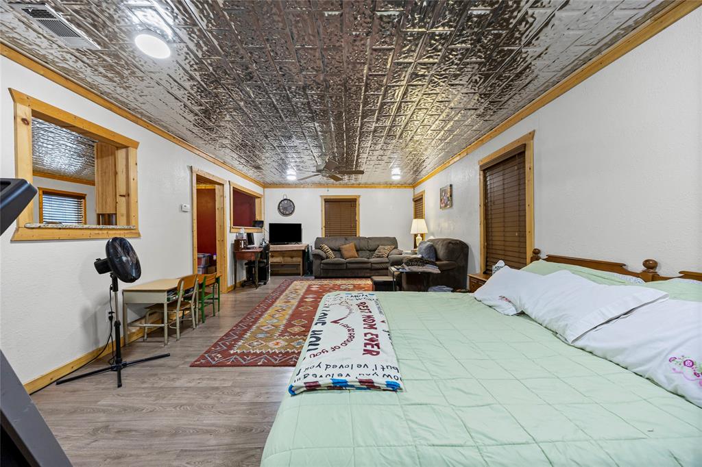 153 Center Loop Whitney, TX 76692 - Photo 11 of 21 a living room with furniture and a chandelier