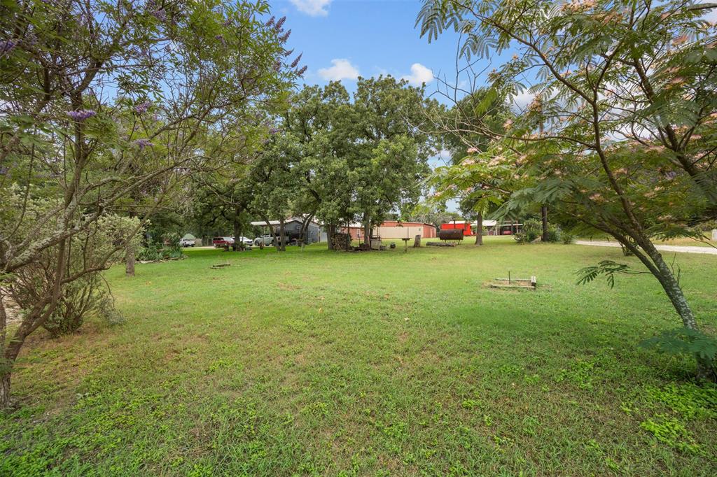 153 Center Loop Whitney, TX 76692 - Photo 19 of 21 a view of a field of grass and trees