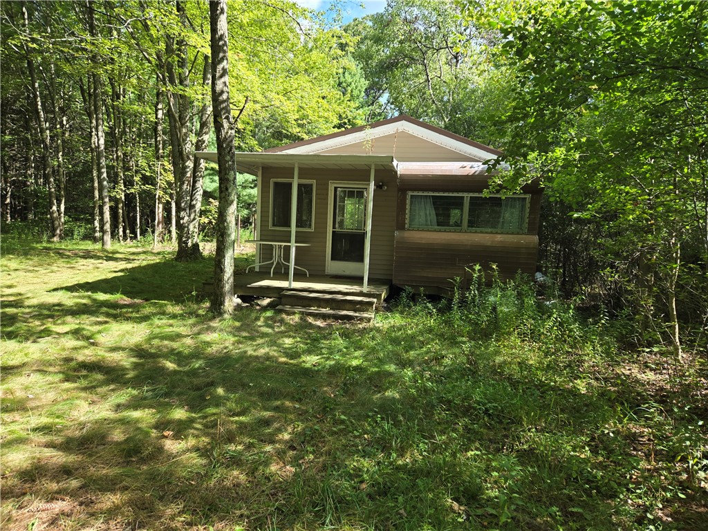 4175 Pre Emption Road Tyrone, NY 14891 - Photo 7 of 19 Rustic cabin tucked in a private wooded setting, s
