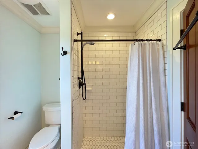 a bathroom with a granite countertop sink mirror and double