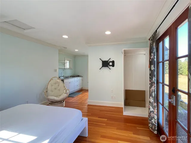 a view of a balcony with chair and potted plants