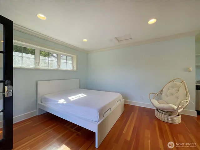 a bedroom with a bed and window