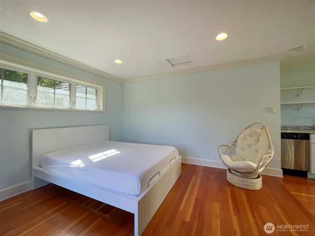 a room with pool table and windows