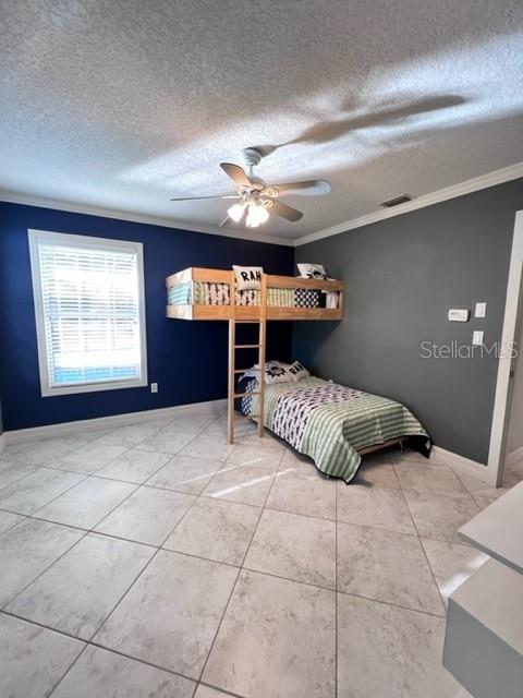 681 Verona Street Port Charlotte, FL 33948 - Photo 13 of 40 a bedroom with a bed and a ceiling fan