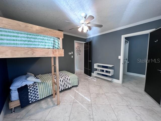 681 Verona Street Port Charlotte, FL 33948 - Photo 14 of 40 a bedroom with a bed and a television