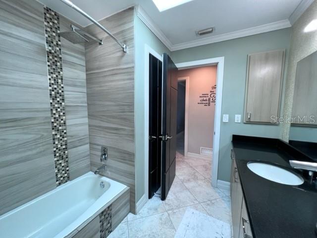 681 Verona Street Port Charlotte, FL 33948 - Photo 17 of 40 a bathroom with a granite countertop sink a toilet and bathtub