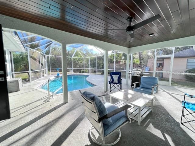 681 Verona Street Port Charlotte, FL 33948 - Photo 2 of 40 a view of a patio with table and chairs potted plants with floor to ceiling window