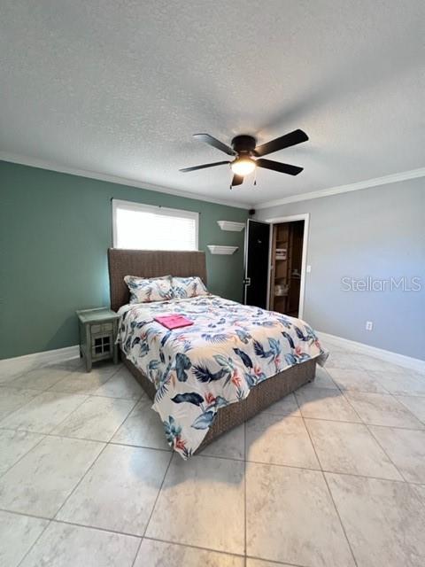 681 Verona Street Port Charlotte, FL 33948 - Photo 21 of 40 a bedroom with a bed and a ceiling fan
