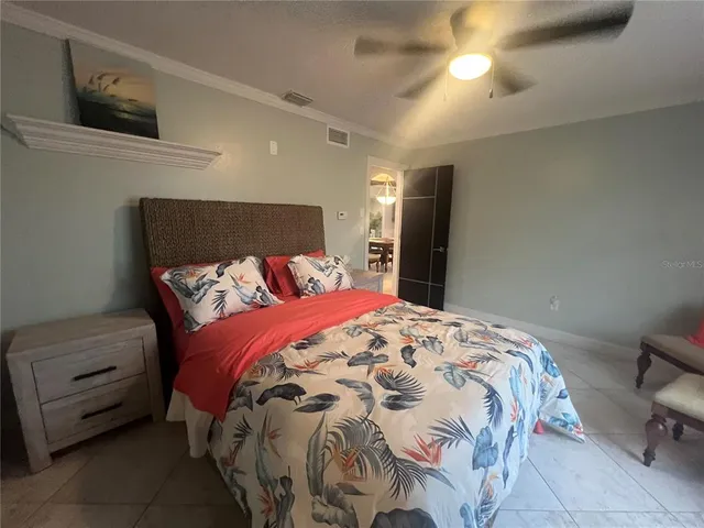 a bedroom with a bed and a cabinets