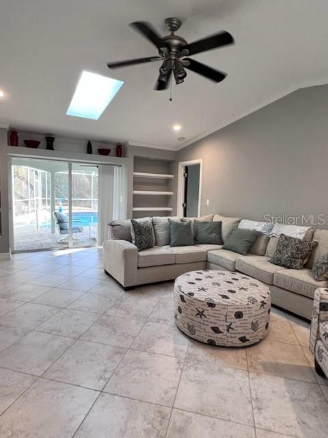 681 Verona Street Port Charlotte, FL 33948 - Photo 26 of 40 a living room with furniture and a large window
