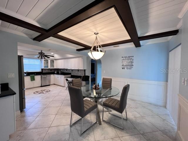 681 Verona Street Port Charlotte, FL 33948 - Photo 35 of 40 a dining room with furniture and a chandelier