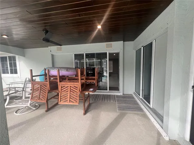 an outdoor space with patio lots of furniture