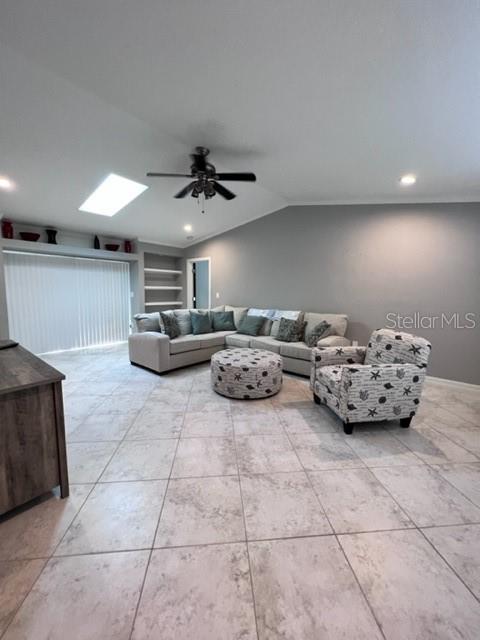 681 Verona Street Port Charlotte, FL 33948 - Photo 38 of 40 a living room with furniture and a ceiling fan