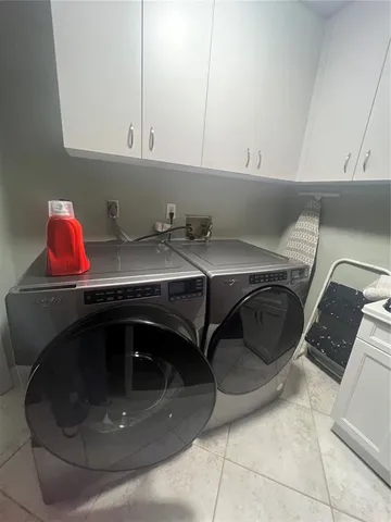 a kitchen with a cabinets and window