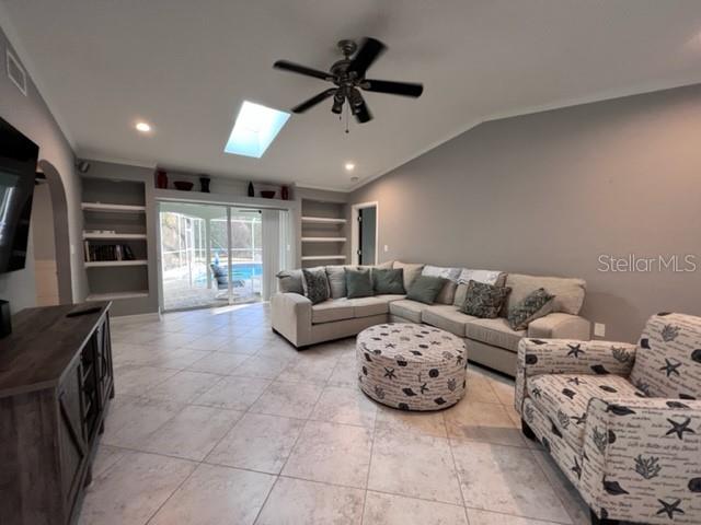 681 Verona Street Port Charlotte, FL 33948 - Photo 5 of 40 a living room with furniture and a flat screen tv