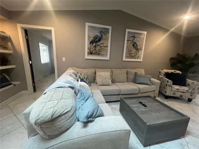 a living room with furniture and a couch