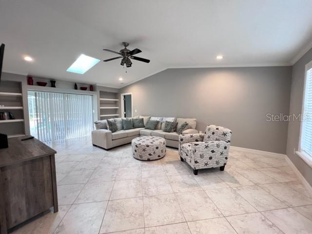 681 Verona Street Port Charlotte, FL 33948 - Photo 10 of 40 a living room with furniture and a chandelier