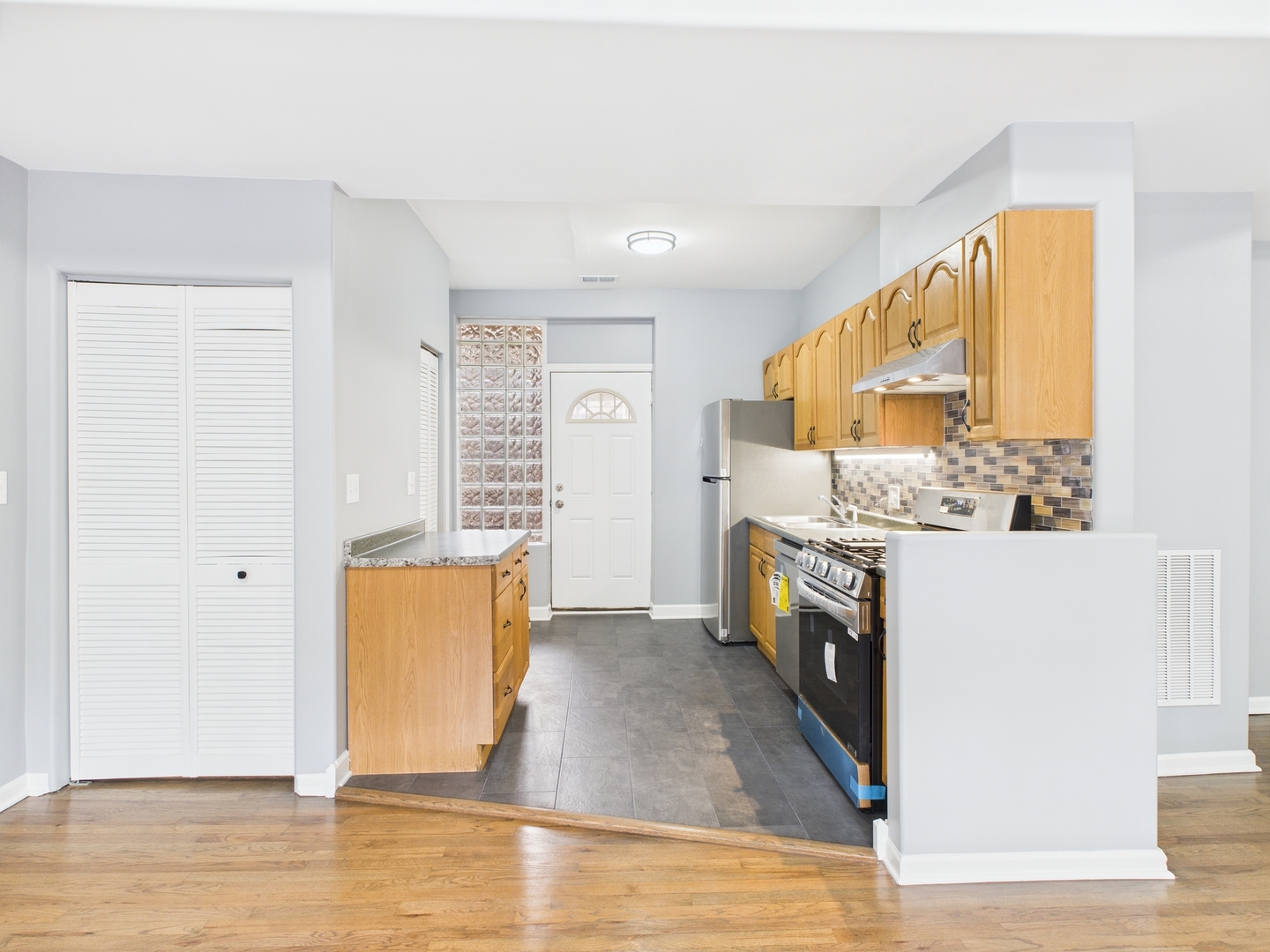 1729 East 67th Street, Unit 2E Chicago, IL 60649 - Photo 12 of 18 a view of living room with granite countertop furniture and a fireplace