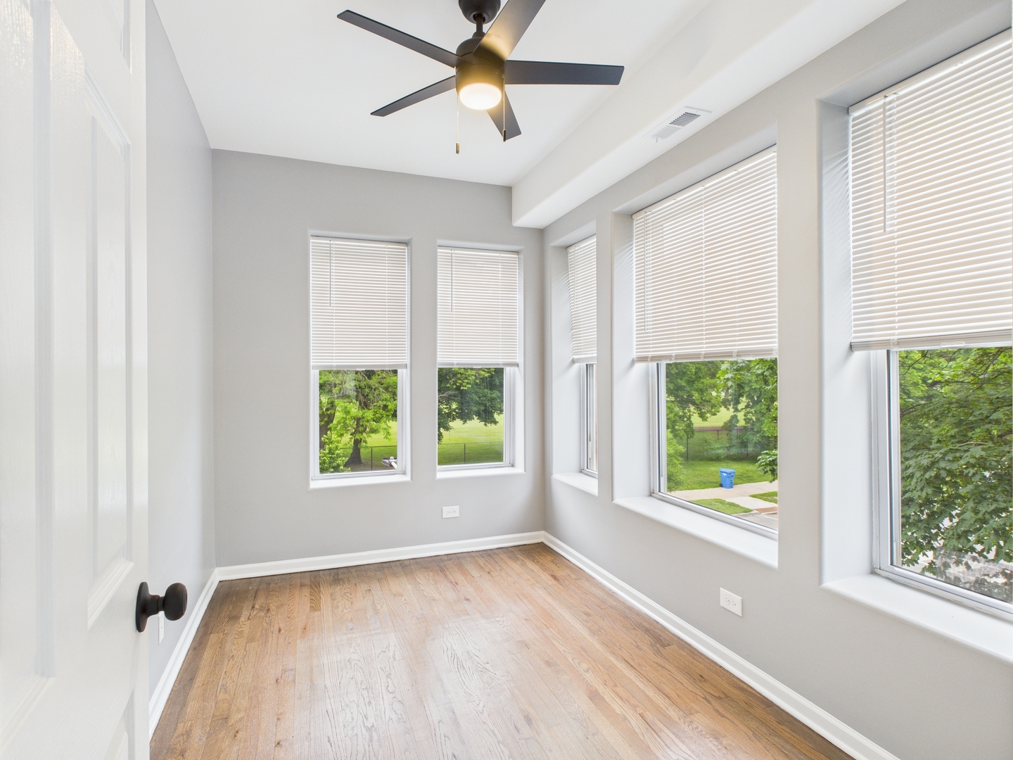 1729 East 67th Street, Unit 2E Chicago, IL 60649 - Photo 8 of 18 a view of an empty room with a window