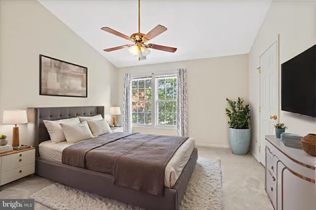 a bedroom with a large bed and a window