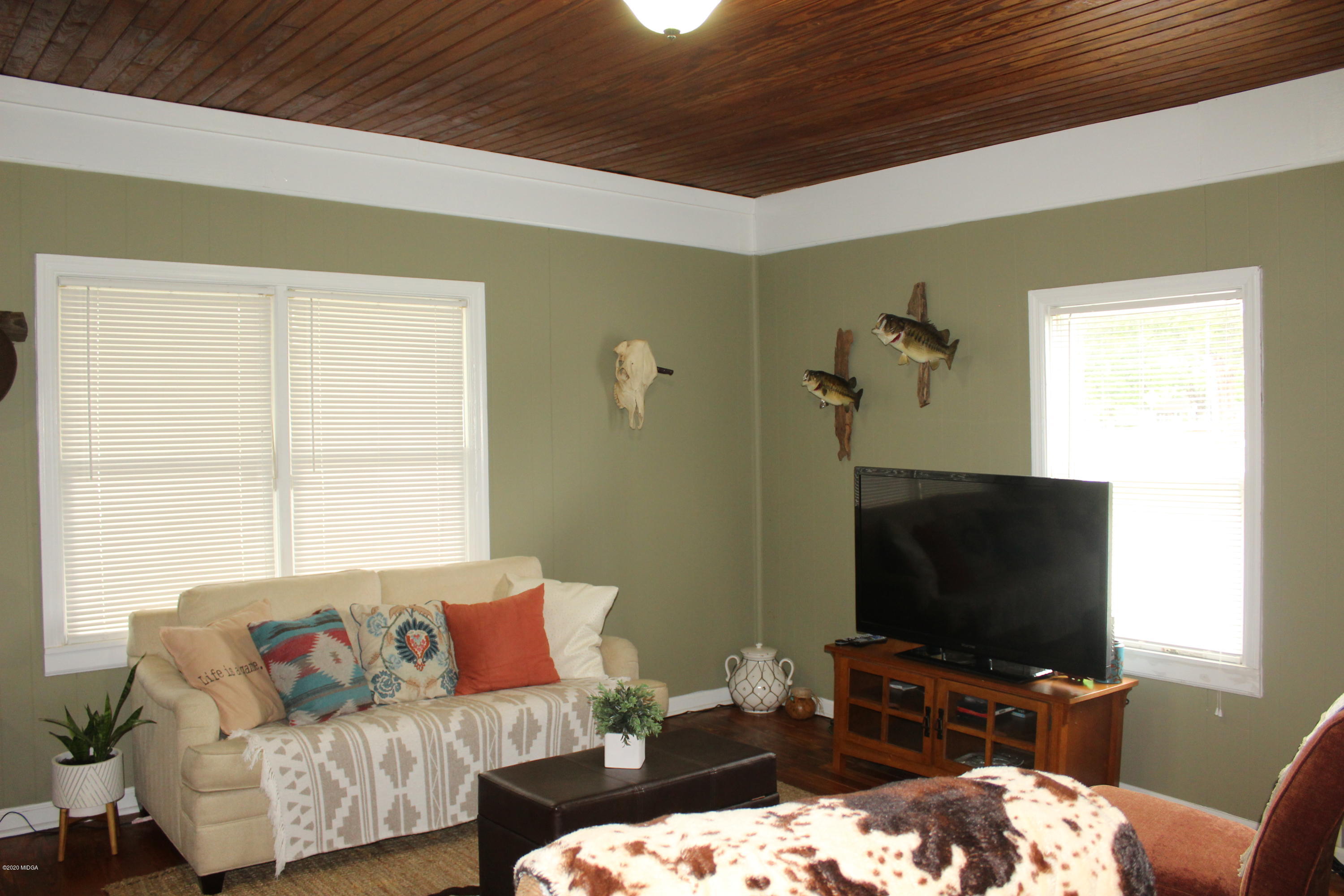 35 Gose Road Forsyth, GA 31029 - Photo 4 of 16 a living room with furniture and a flat screen tv
