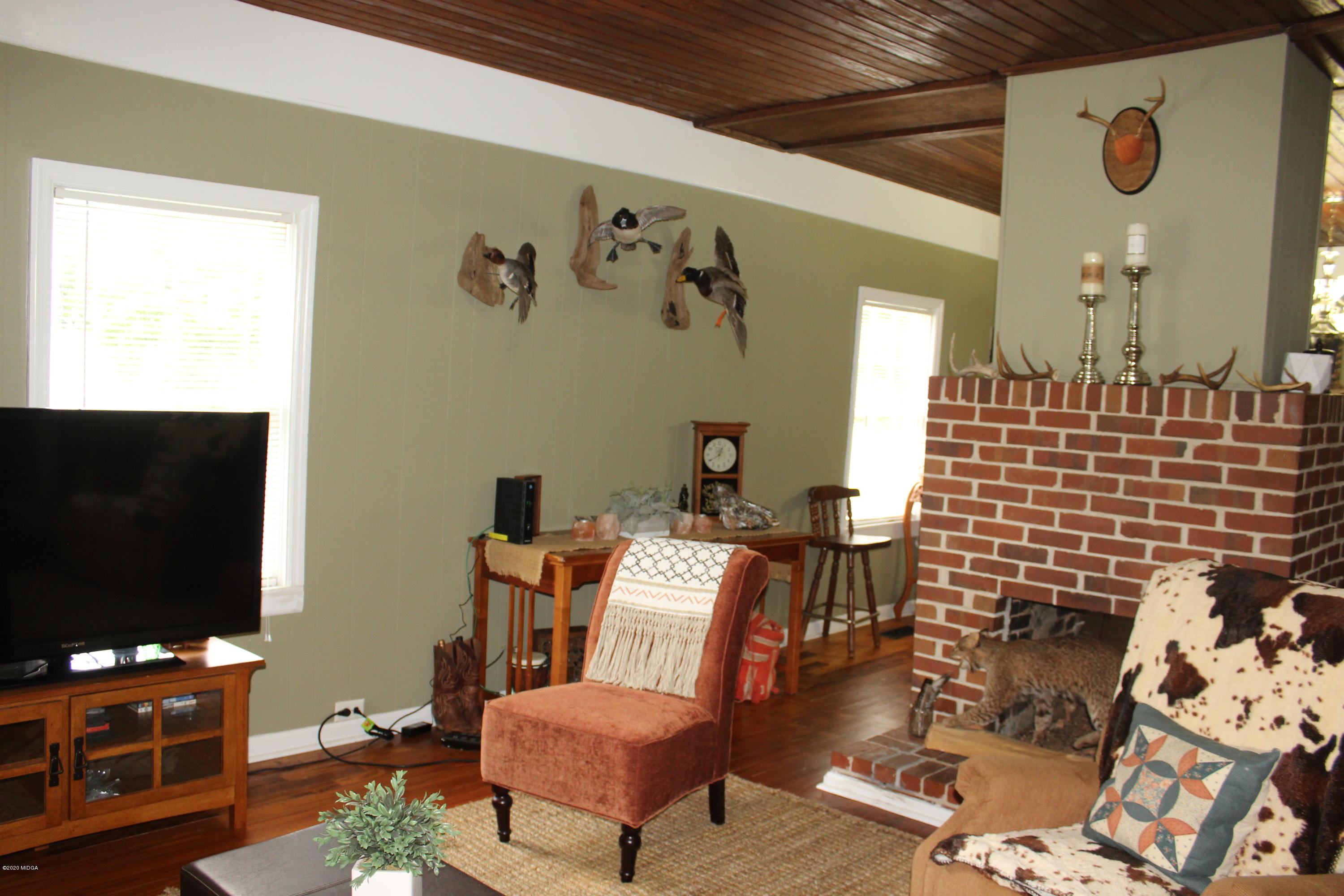 35 Gose Road Forsyth, GA 31029 - Photo 5 of 16 a living room with furniture and a flat screen tv