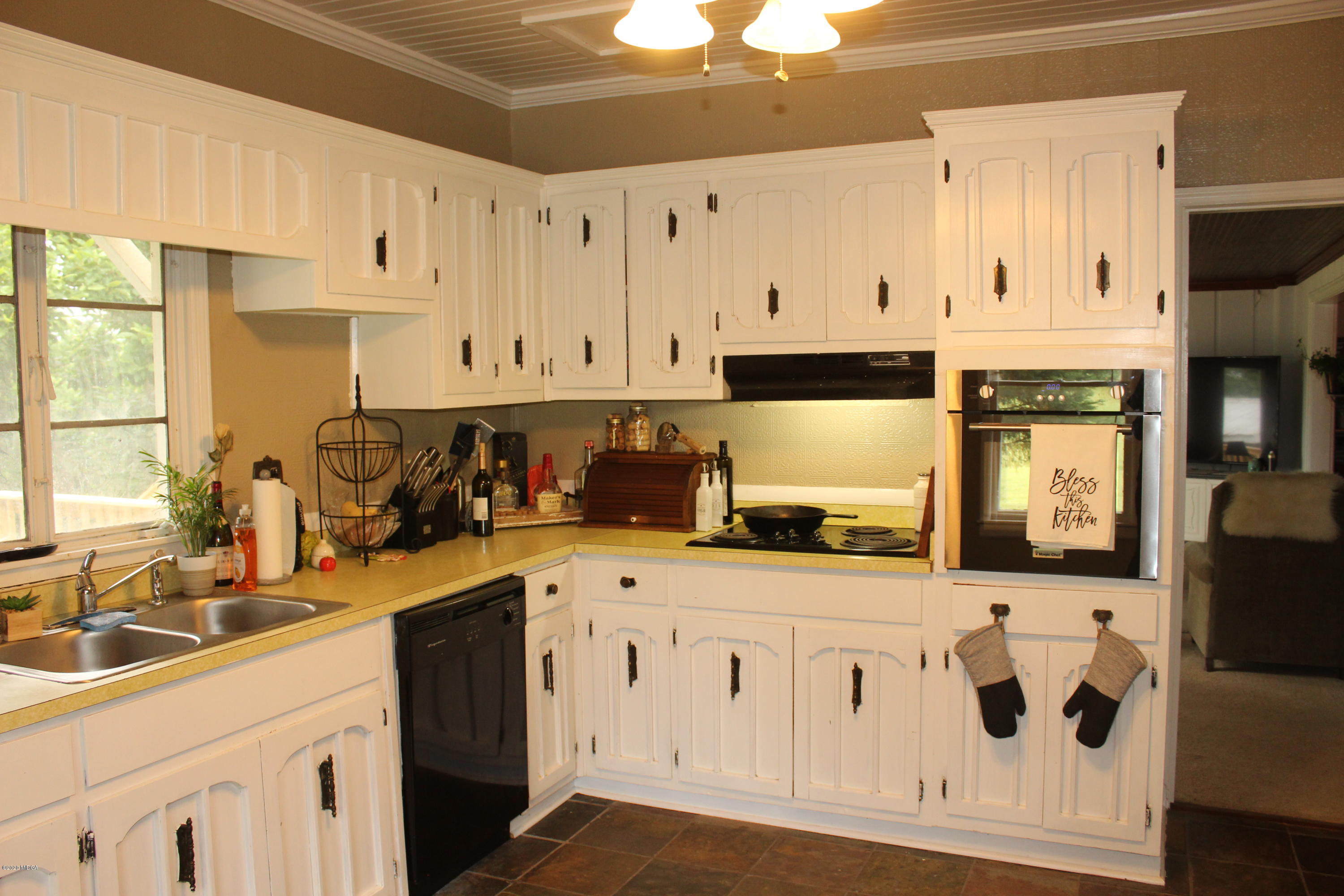35 Gose Road Forsyth, GA 31029 - Photo 7 of 16 a kitchen with stainless steel appliances granite countertop a sink a stove and a refrigerator