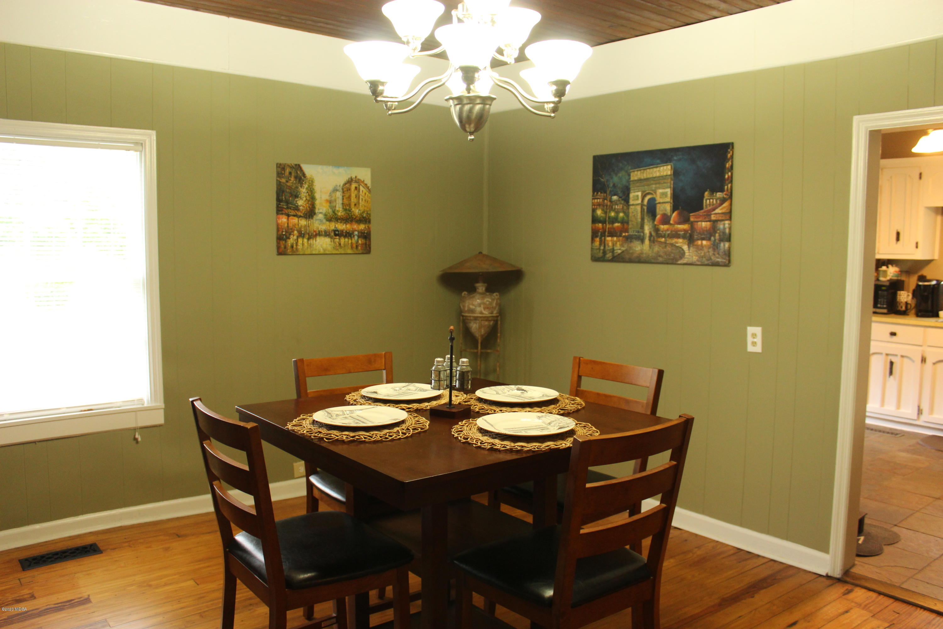 35 Gose Road Forsyth, GA 31029 - Photo 9 of 16 a view of a dining room with furniture and wooden floor