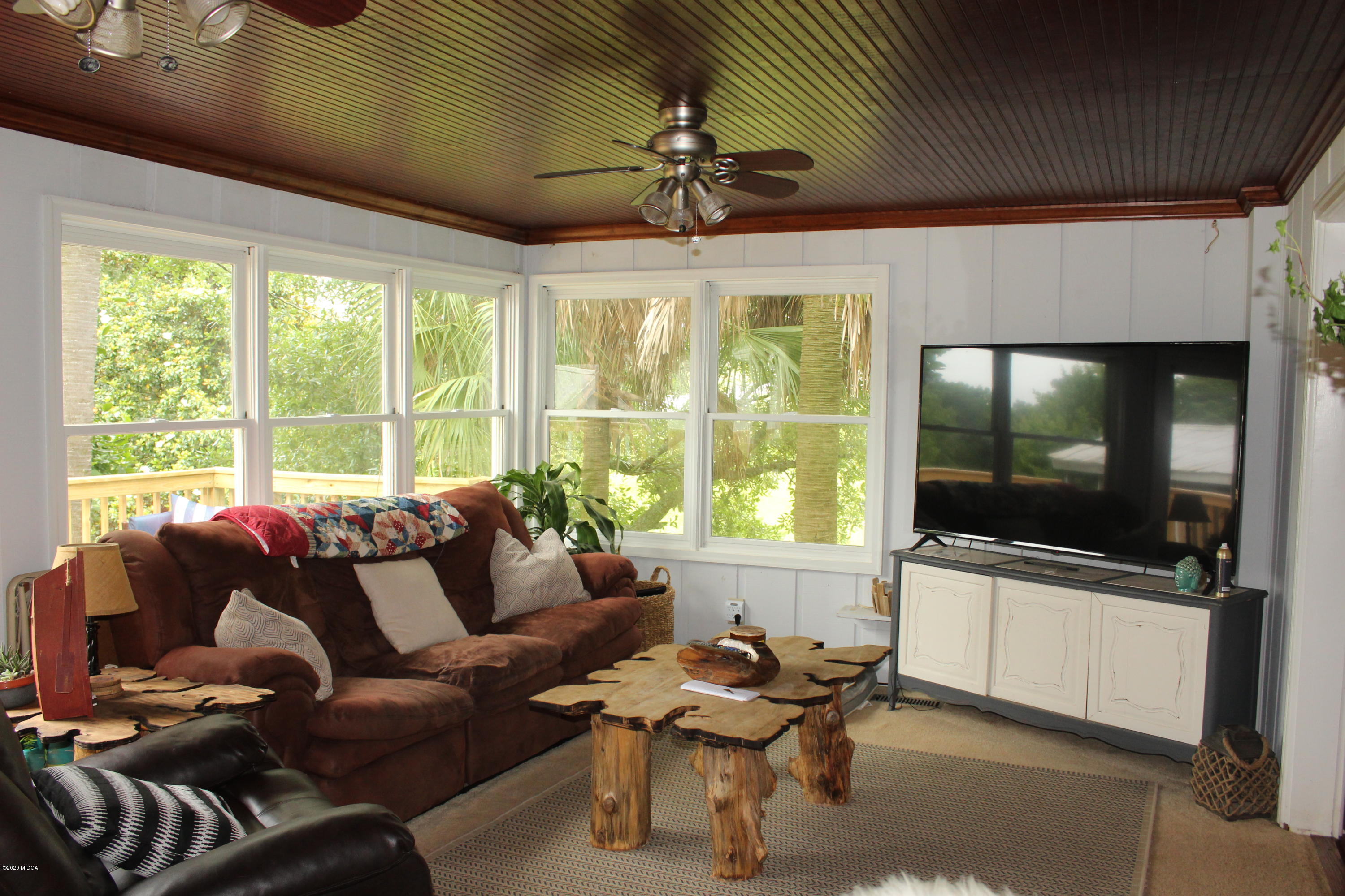 35 Gose Road Forsyth, GA 31029 - Photo 10 of 16 a living room with furniture and a flat screen tv
