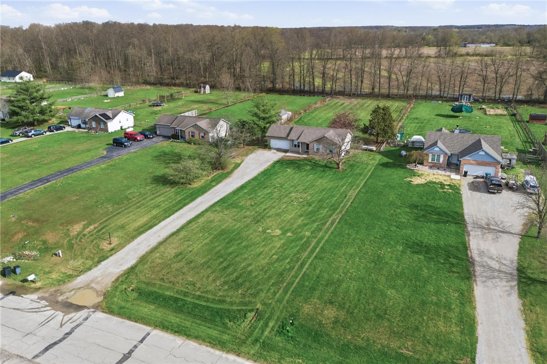 8747 Waynes Way Blanchester, OH 45107 - Photo 34 of 40 Expansive green spaces and mature trees surround these charming residential homes.