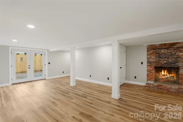 a room with a bed and a fireplace