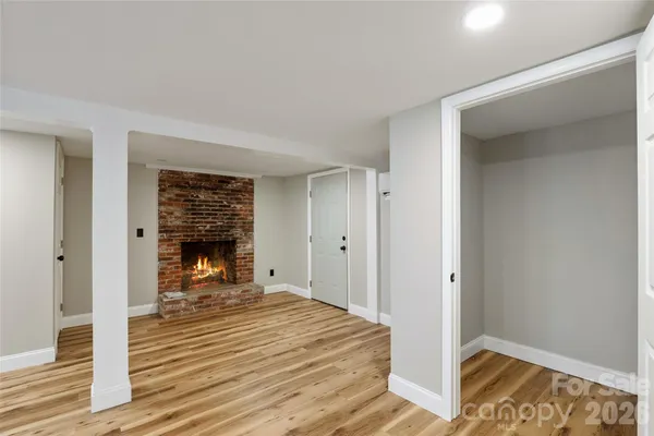 a view of a room with wooden walls