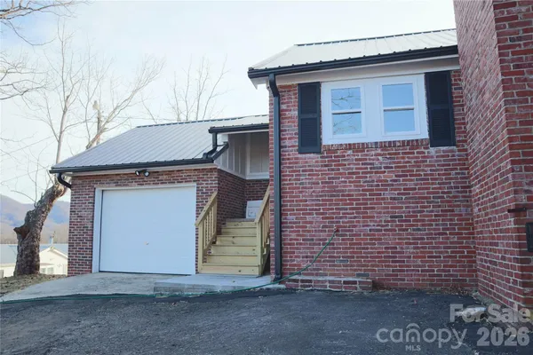 a front view of a house with a garage