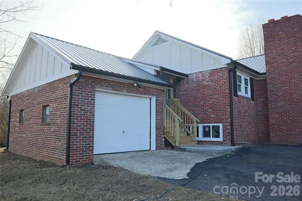 a front view of a house with a garage