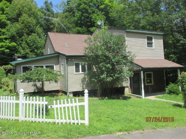 1323 Millcreek Road Newfoundland, PA 18445 - Photo 1 of 18 a house view with a garden space