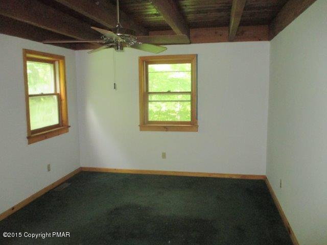 1323 Millcreek Road Newfoundland, PA 18445 - Photo 13 of 18 an empty room with a window