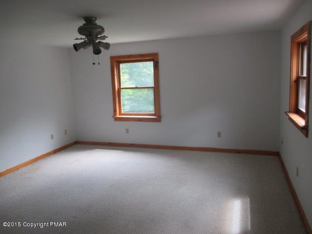1323 Millcreek Road Newfoundland, PA 18445 - Photo 14 of 18 an empty room with a window