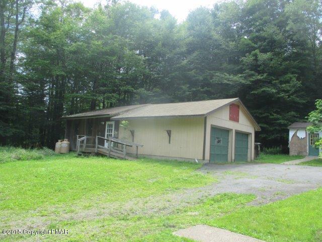 1323 Millcreek Road Newfoundland, PA 18445 - Photo 17 of 18 a backyard of a house with yard and trampoline
