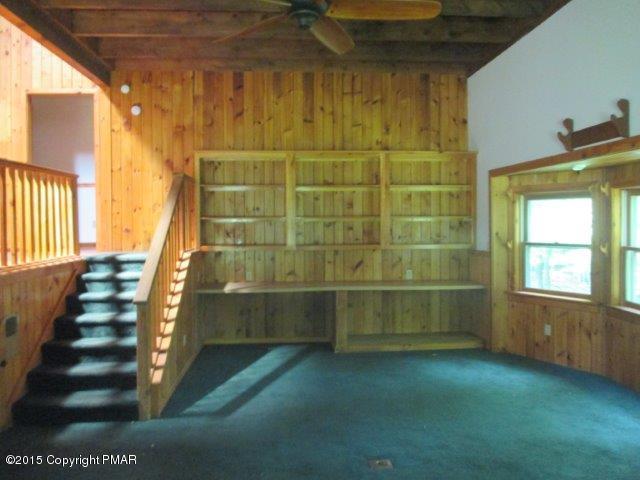 1323 Millcreek Road Newfoundland, PA 18445 - Photo 2 of 18 a view of an empty room with stairs and wooden floor