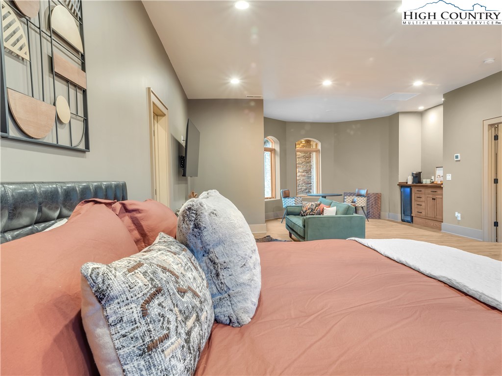 216 Greenbriar Road Beech Mountain, NC 28604 - Photo 20 of 50 a bed room with a bed and a mirror