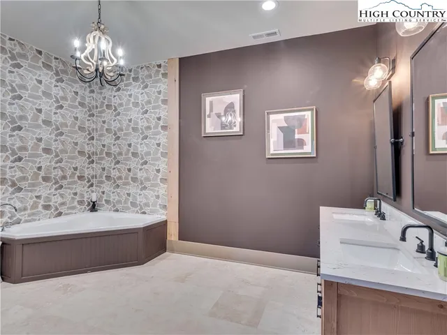 a bathroom with a bathtub and a sink