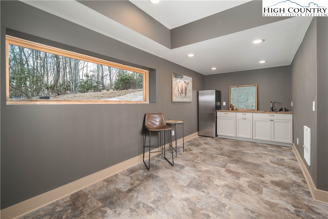 216 Greenbriar Road Beech Mountain, NC 28604 - Photo 33 of 50 a view of a kitchen with furniture and a window